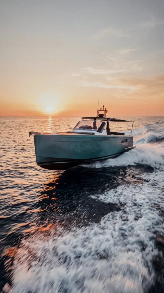 Aerial shot of the Fjord 40 Open Baia cruising with guests on the bow sunbed